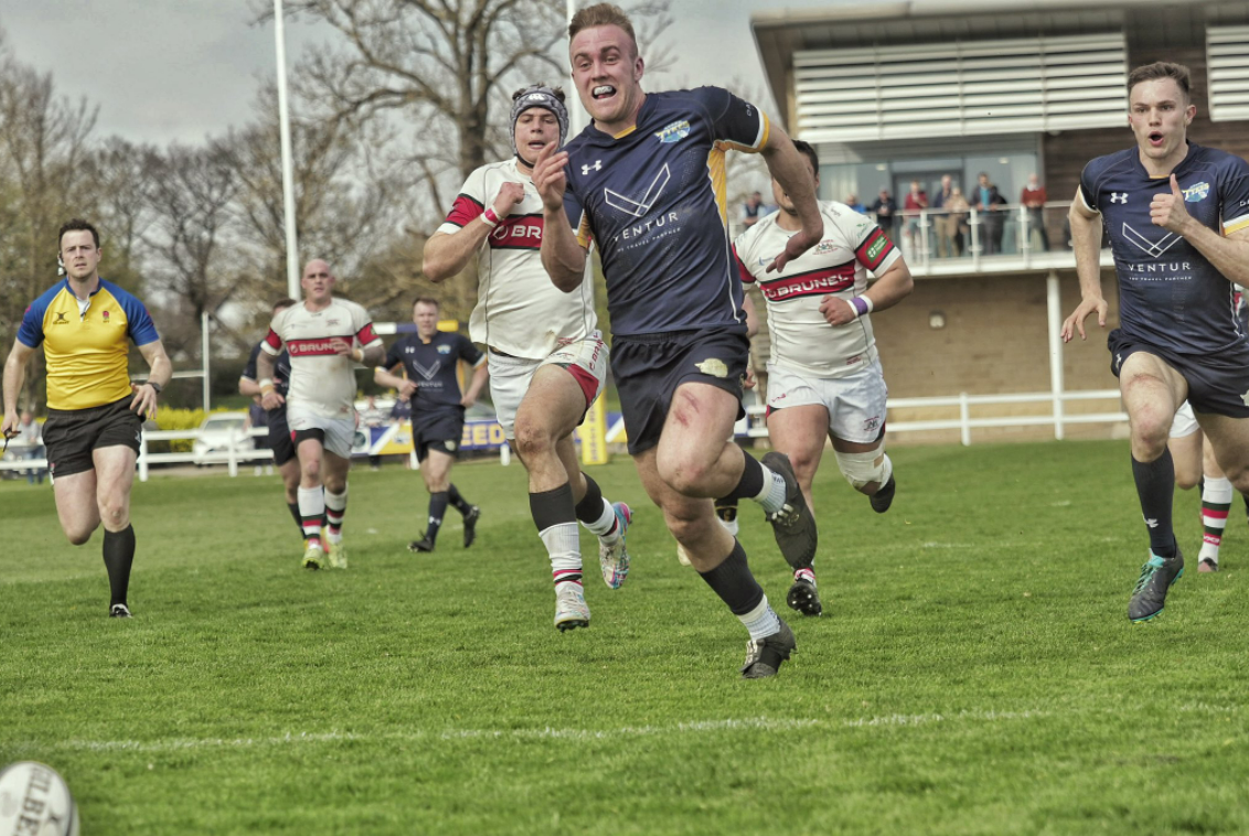 Paddy Case chases the ball