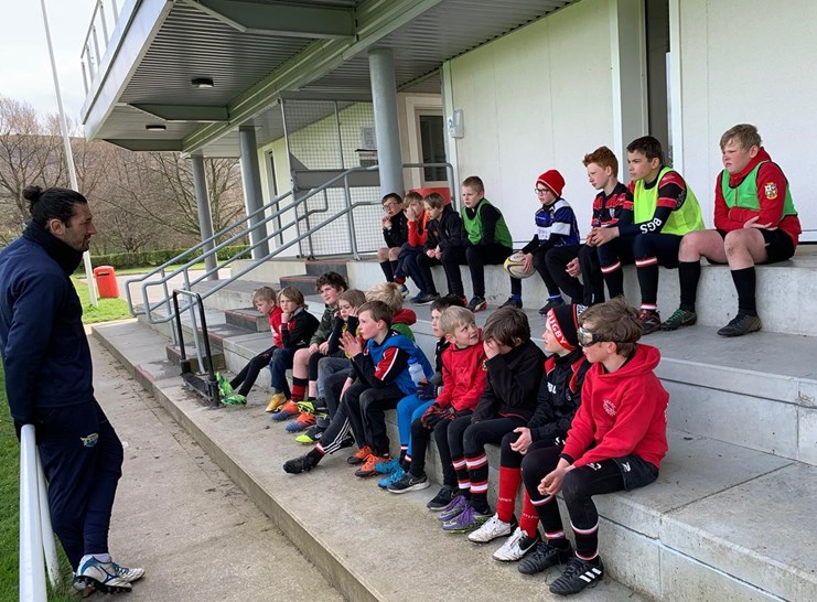 Jake Brady, club captain, delivering an after school coaching session